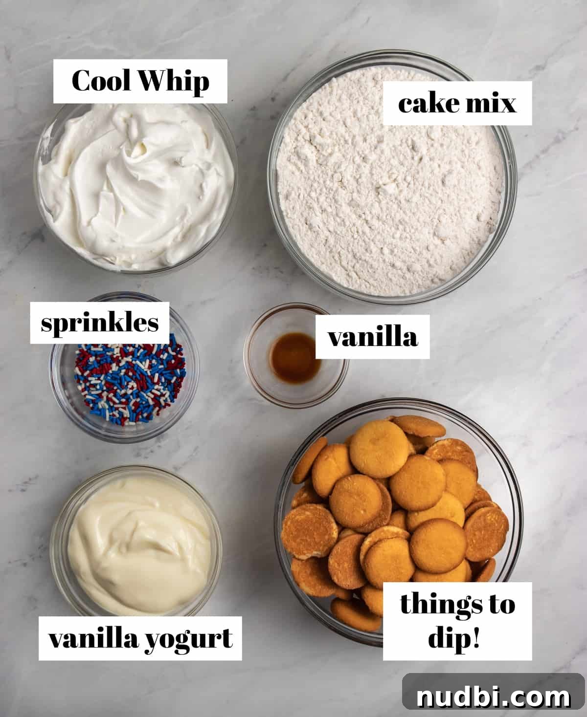 Patriotic Funfetti Dip Recipe for 4th of July Parties 4 Cool whip, sprinkles, vanilla and cake mix labeled on counter.