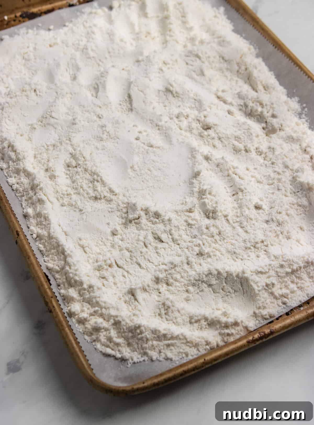 Patriotic Funfetti Dip Recipe for 4th of July Parties 5 Sheet pan with cake mix spread evenly over top.