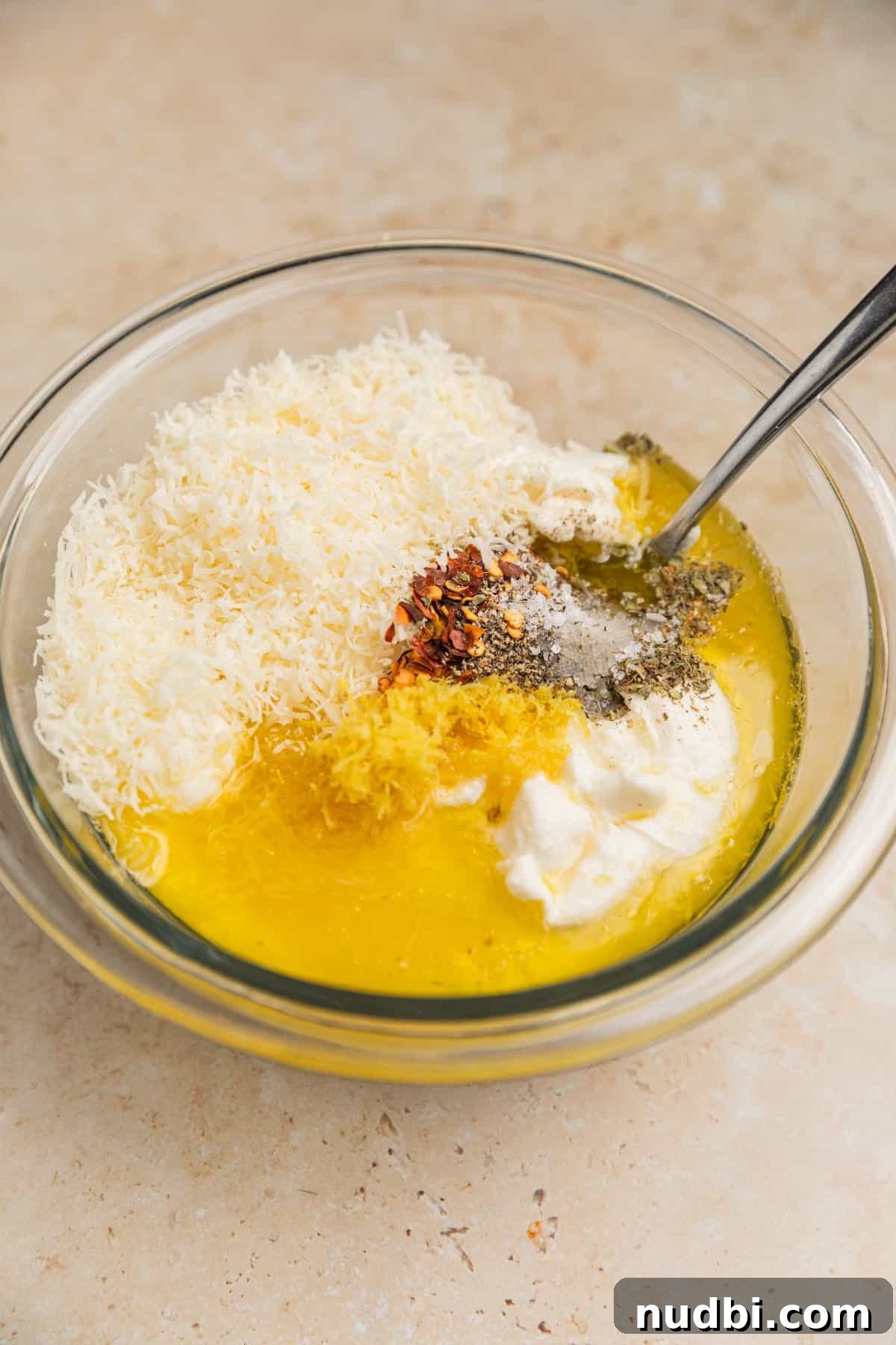 20-Minute Lemon Ricotta Pasta Recipe for Creamy Weeknight Meals 5 Lemon zest, parmesan, ricotta, olive oil and other ingredients added to bowl.