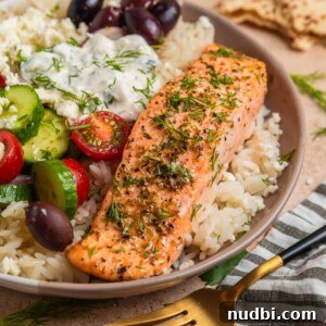 Greek Salmon Rice Bowls with Tzatziki and Lemon Dill 10 Baked salmon filet with oregano and Greek flavors on top of rice with feta, olives and other toppings.