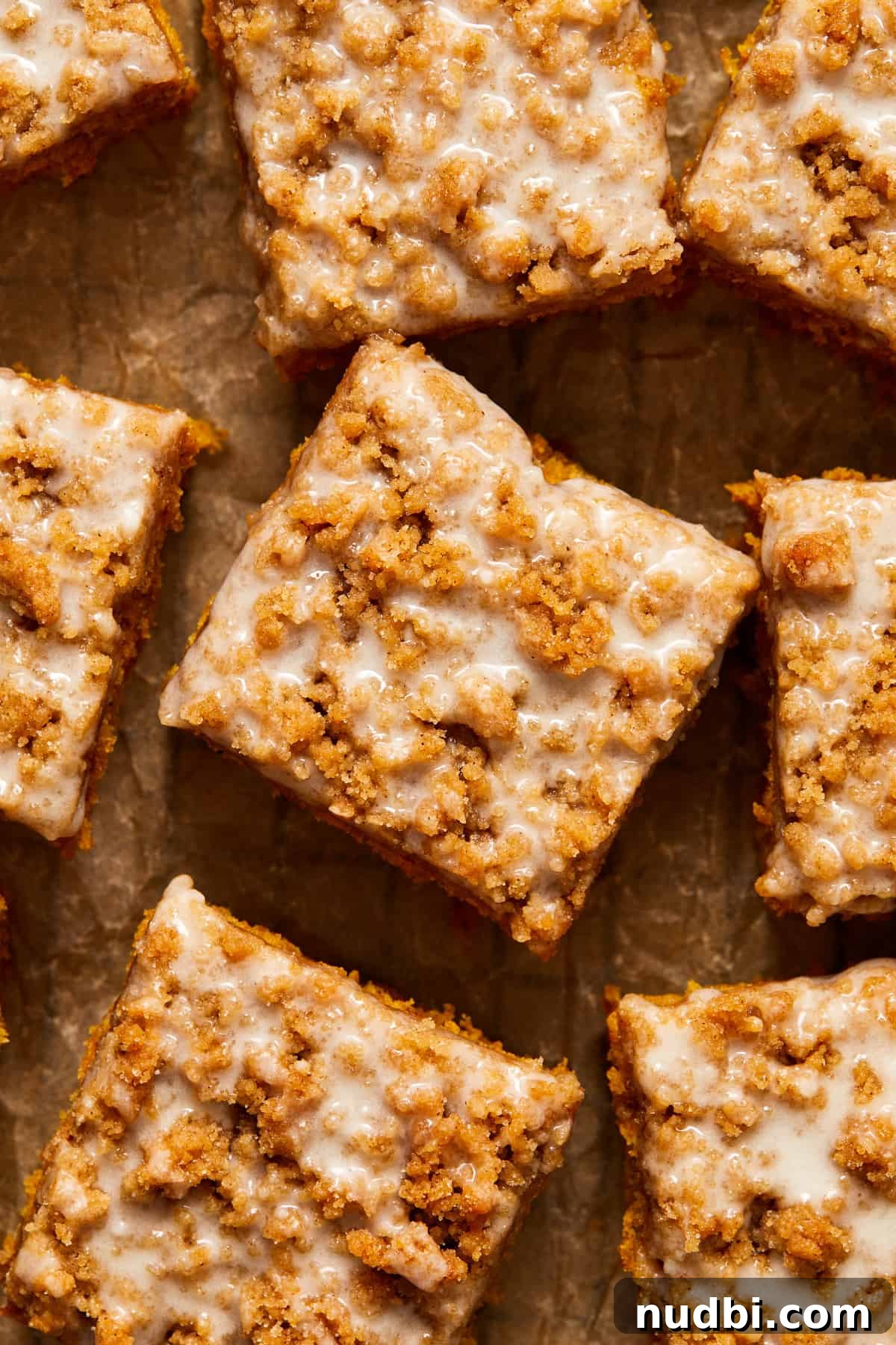 Cinnamon Streusel Pumpkin Coffee Cake Recipe for Fall Baking 16 Overhead view of pumpkin coffee cake with crumble topping and glaze.