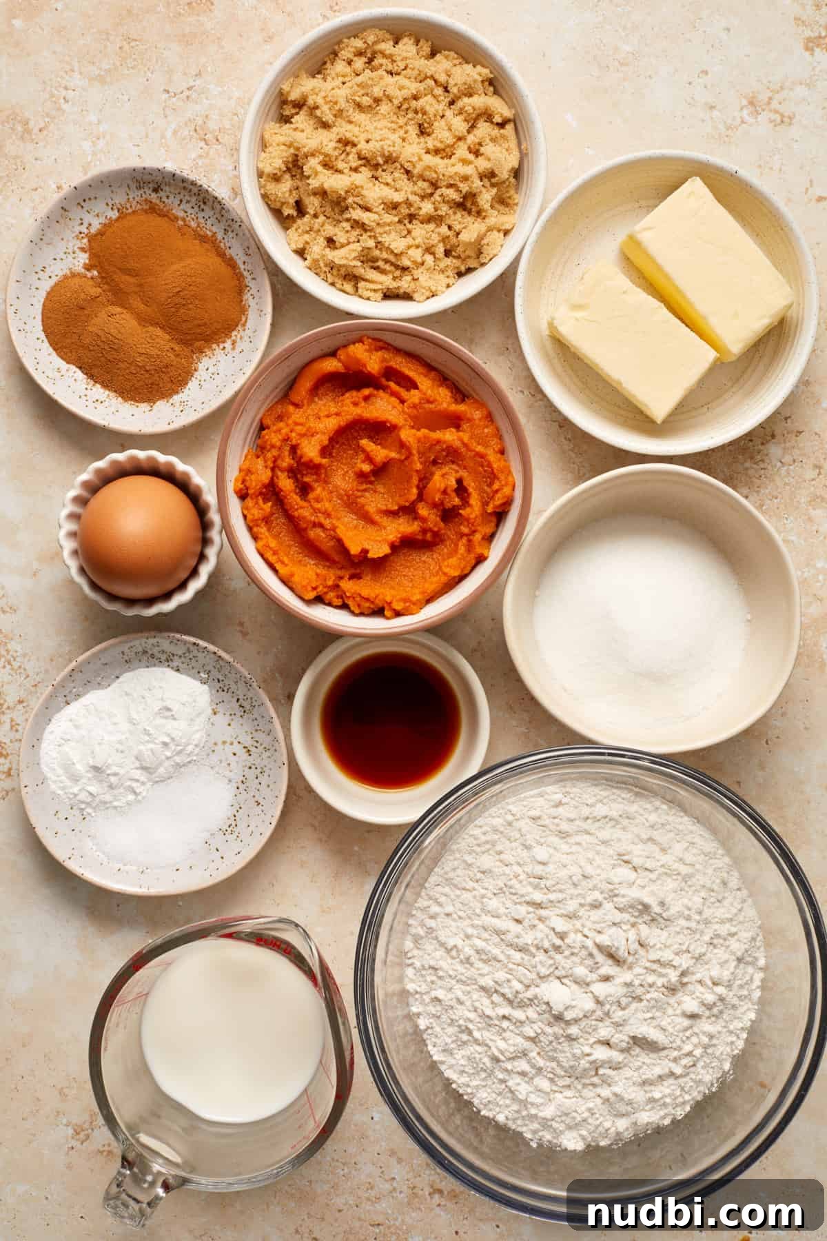 Cinnamon Streusel Pumpkin Coffee Cake Recipe for Fall Baking 4 Brown sugar, flour, pumpkin, egg and other ingredients arranged on surface to make recipe.