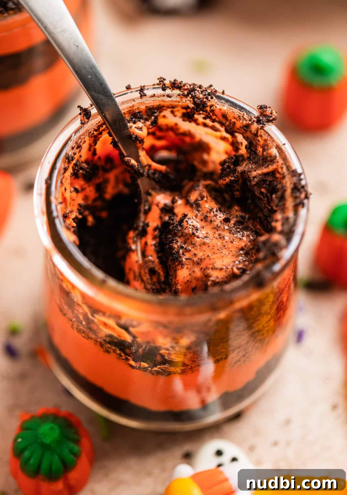 Halloween Oreo Dirt Cake Recipe for Spooky No-Bake Dessert 9 Halloween dirt cake cup with spoon in cup.