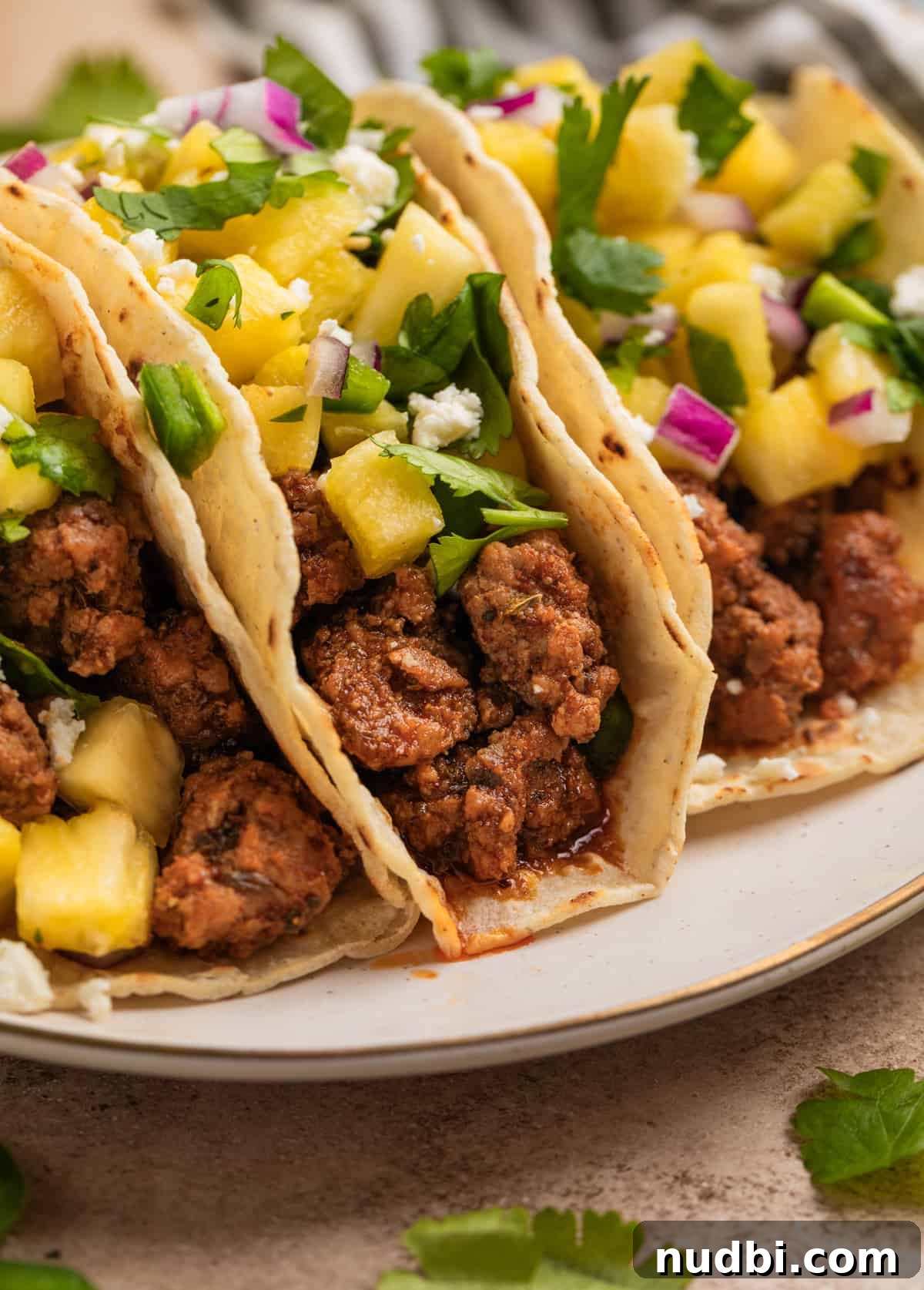 Pineapple Salsa Ground Pork Tacos: Sweet & Spicy Street-Style Recipe 3 Tacos with ground pork, pineapple salsa and cojita cheese.