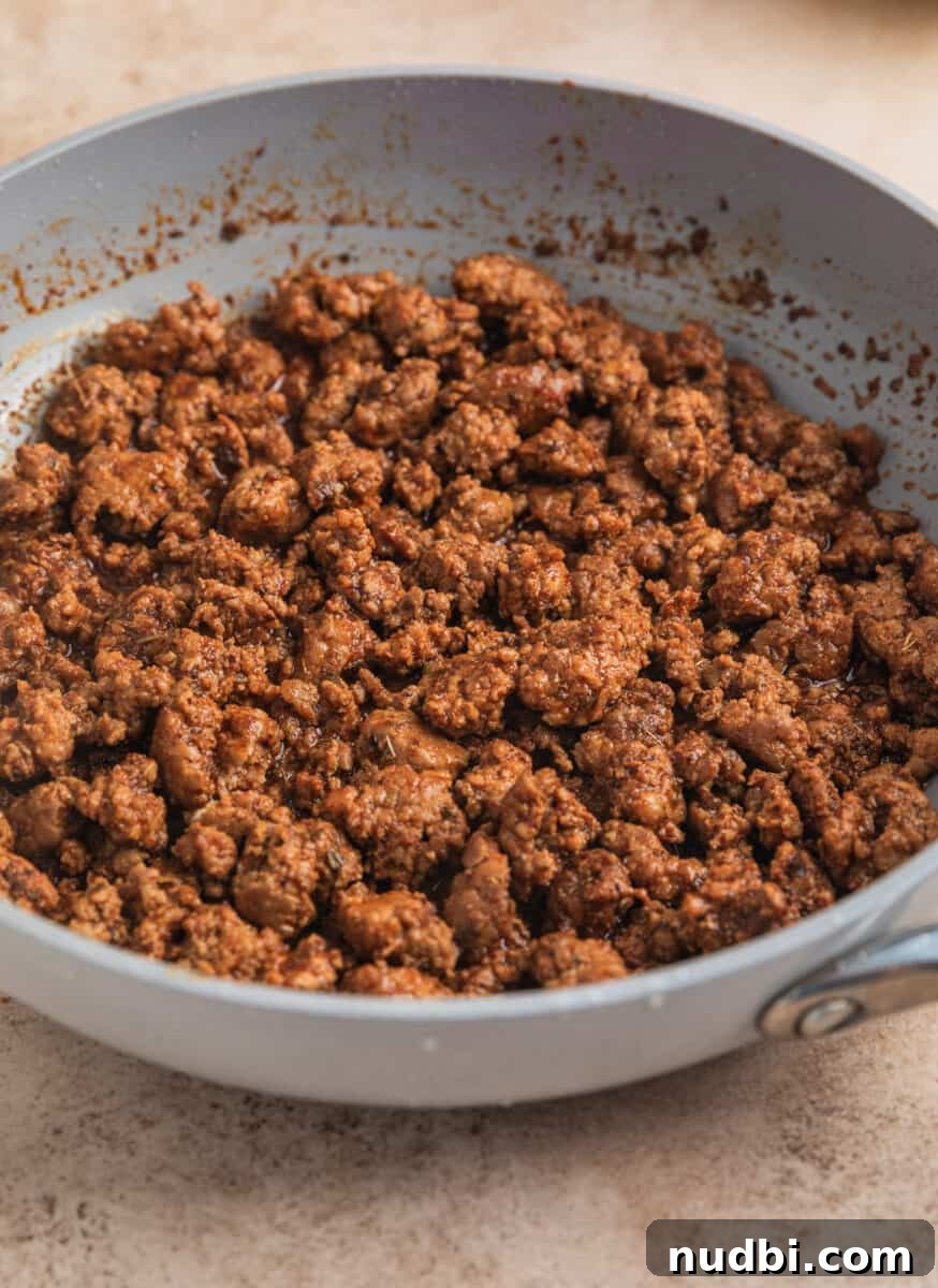 Pineapple Salsa Ground Pork Tacos: Sweet & Spicy Street-Style Recipe 8 Ground pork taco meat cooked in skillet.