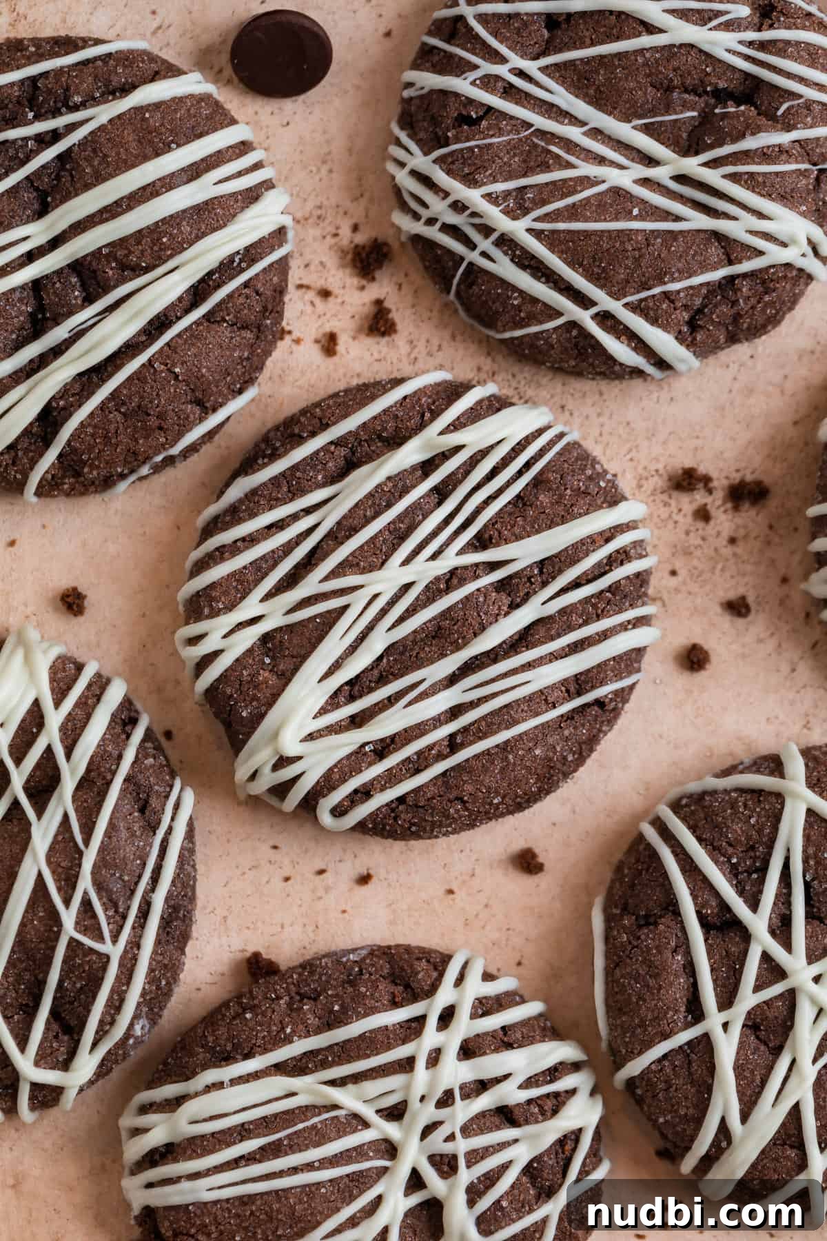Chewy Chocolate Cake Mix Cookies Recipe for Perfect Cocoa Treats 2 Chocolate cake mix cookies on counter with white chocolate drizzle.