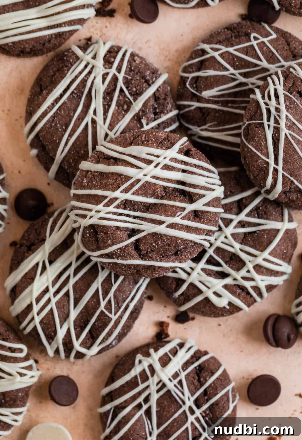 Chewy Chocolate Cake Mix Cookies Recipe for Perfect Cocoa Treats 9 Chocolate cookies arranged on counter with crumbs and chocolate chips surrounding.