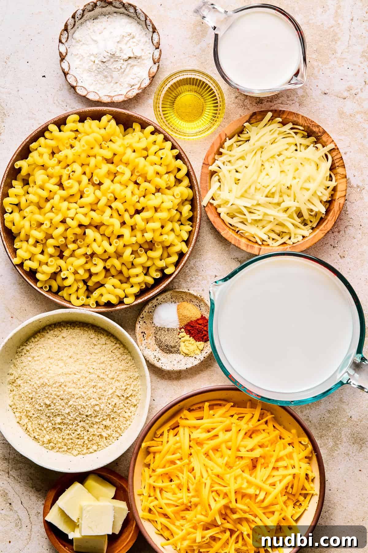 Creamy Cheddar and Gruyère Macaroni Bake 3 Pasta, shredded cheese, milk and other ingredients to make recipe.