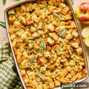Pan with apple stuffing topped with herbs.