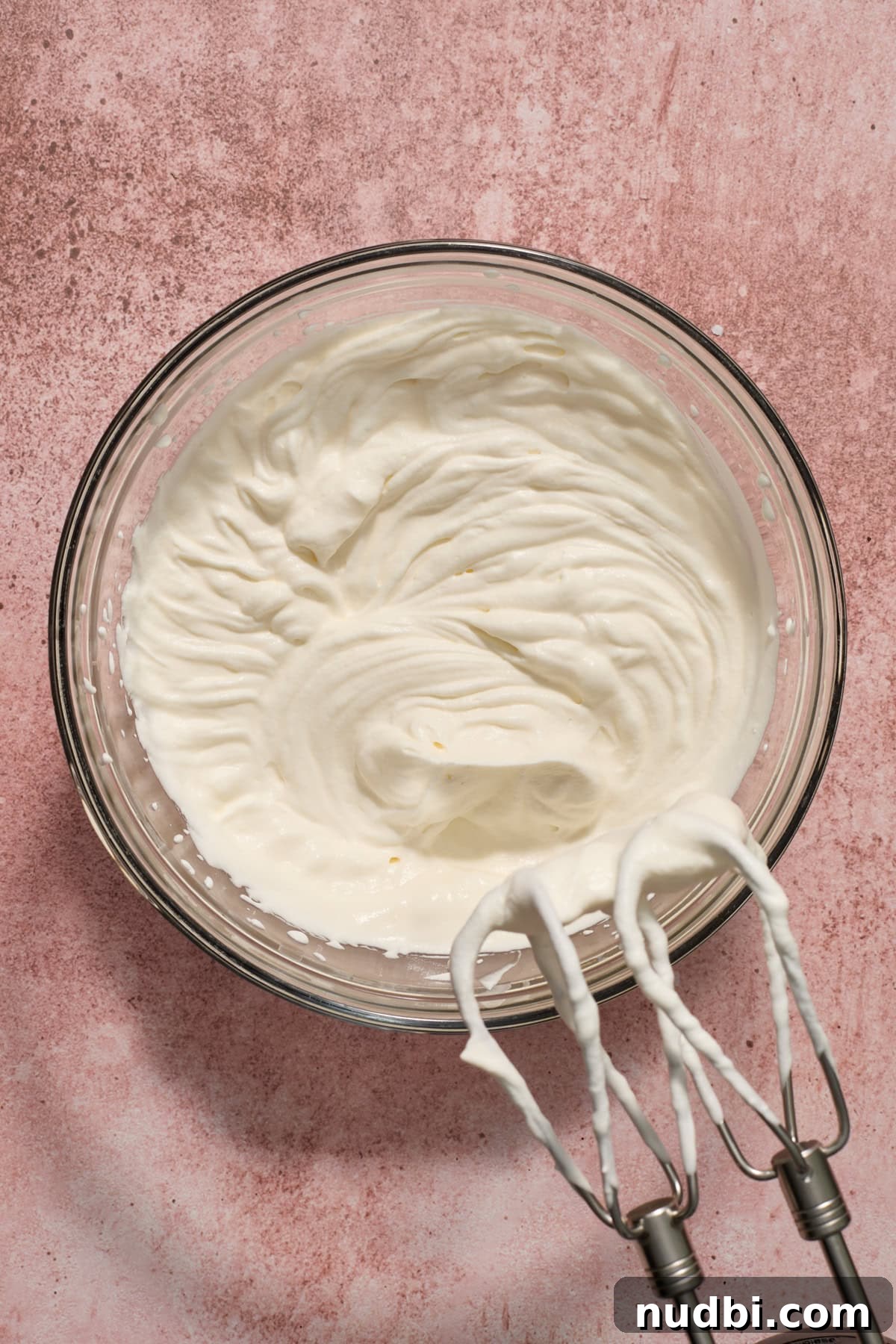 No‑Bake Peppermint Oreo Cheesecake Recipe for the Holidays 11 Heavy whipping cream whipped to stiff peaks in mixing bowl.