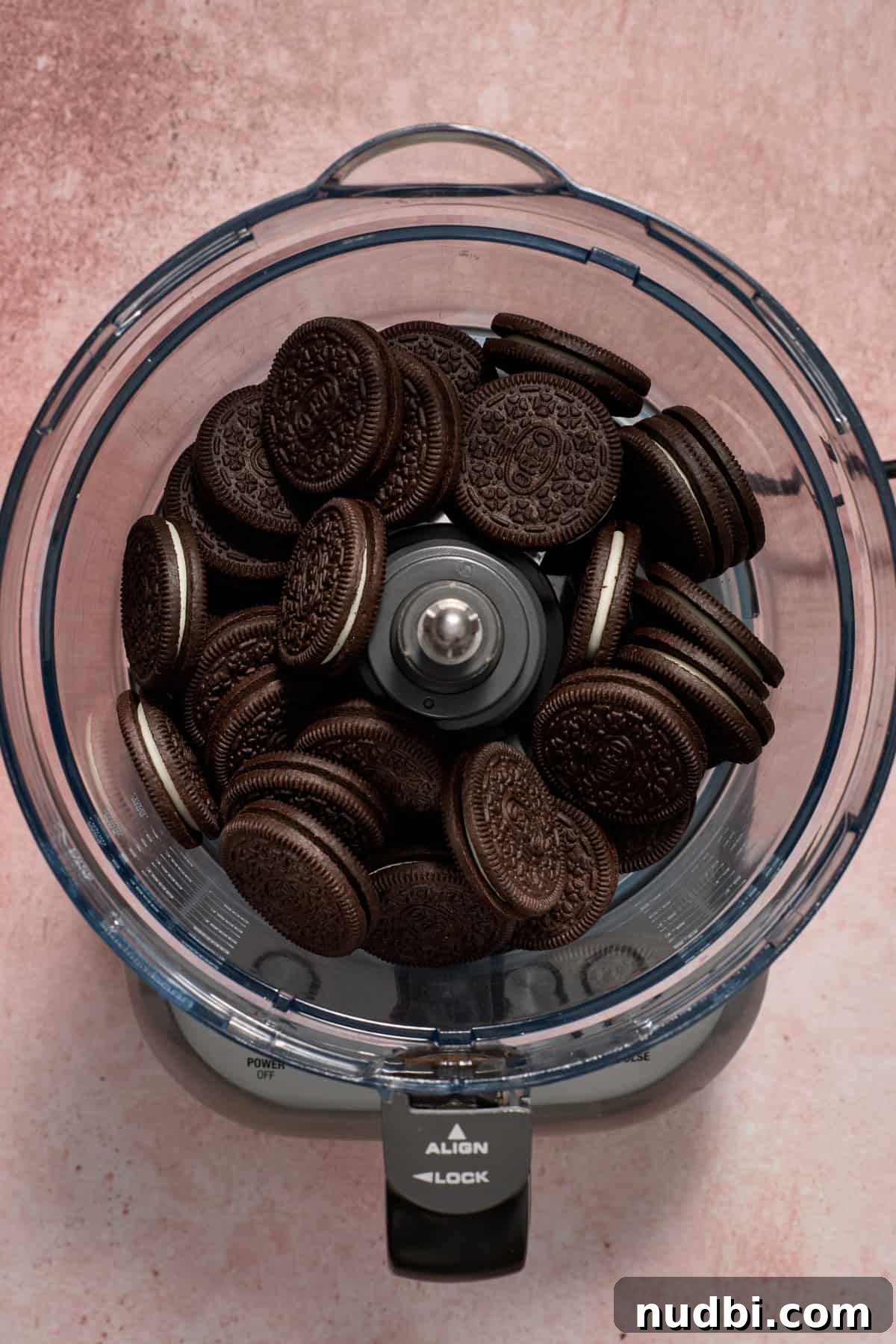No‑Bake Peppermint Oreo Cheesecake Recipe for the Holidays 5 Oreo cookies in food processor before being crushed.