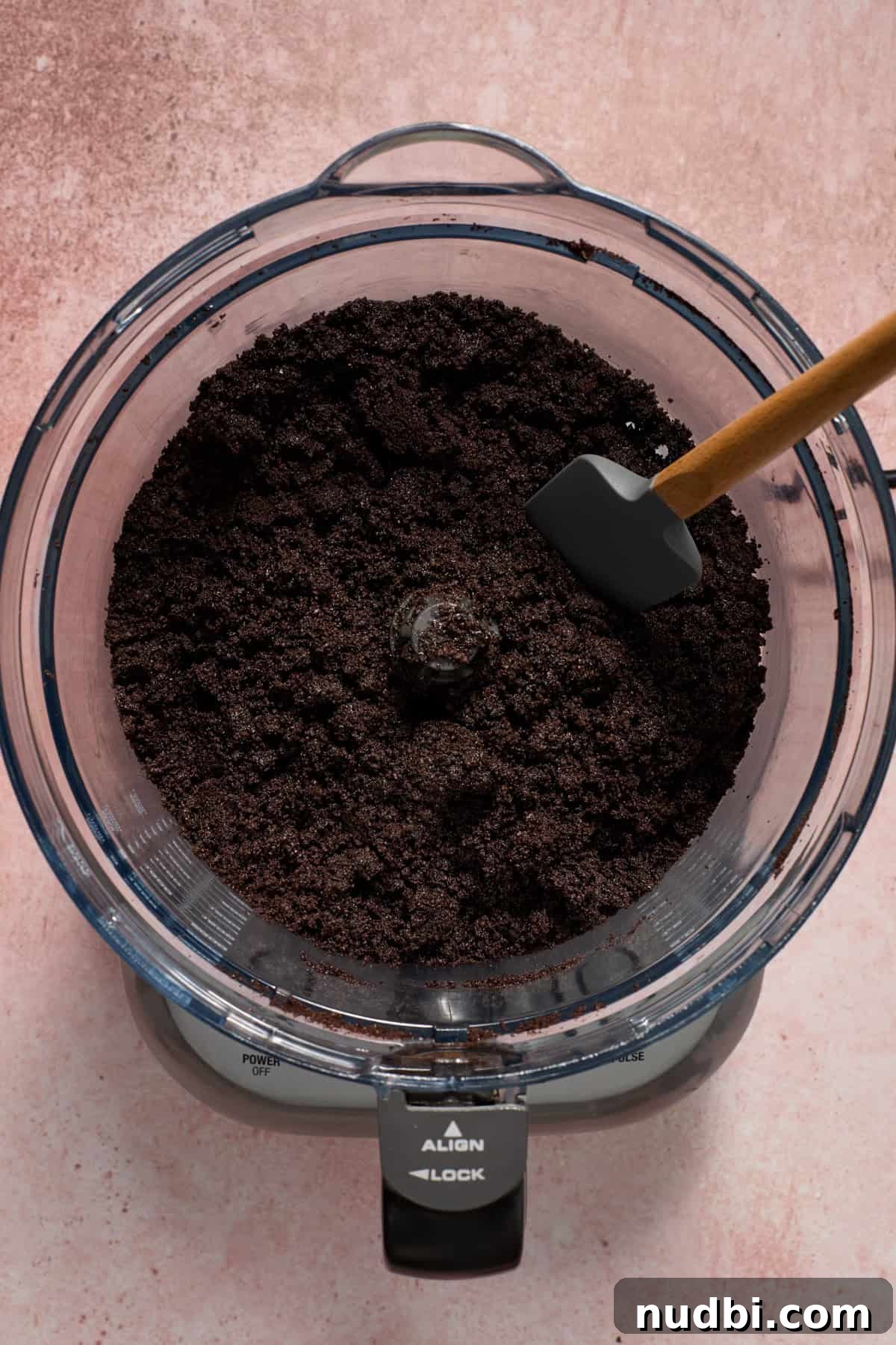 No‑Bake Peppermint Oreo Cheesecake Recipe for the Holidays 7 Chocolate cookie pie crust prepared in food processor with spatula.