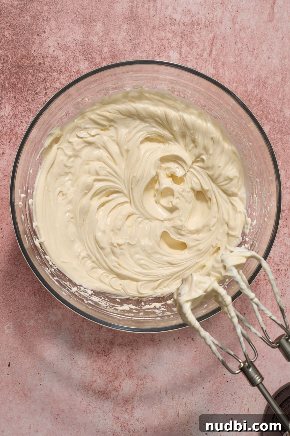 No‑Bake Peppermint Oreo Cheesecake Recipe for the Holidays 10 No bake cheesecake mixture in glass bowl.