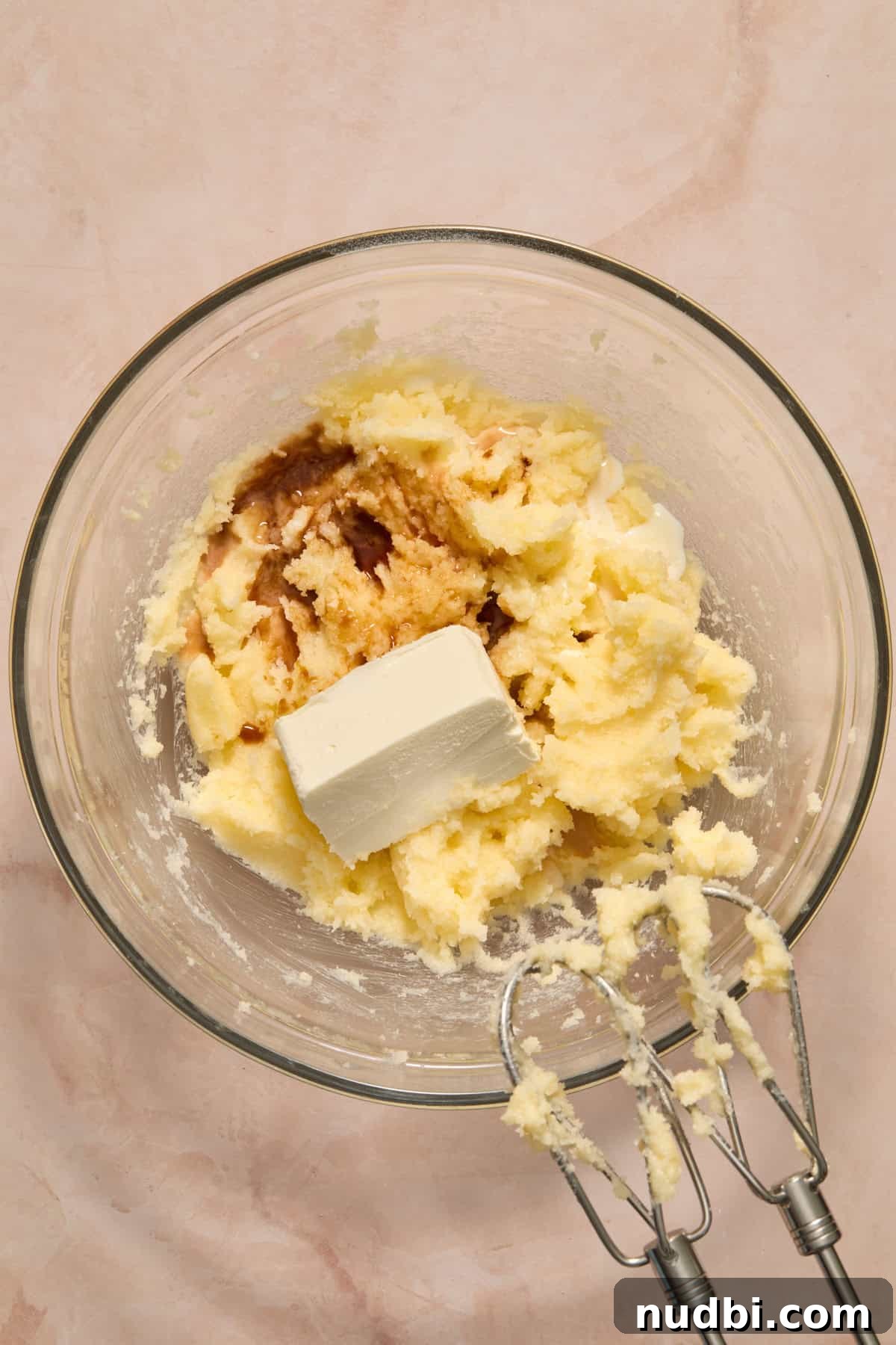Soft and Chewy Eggless Sugar Cookies Recipe 4 Creamed butter and sugar in bowl with cream cheese and vanilla added into bowl.