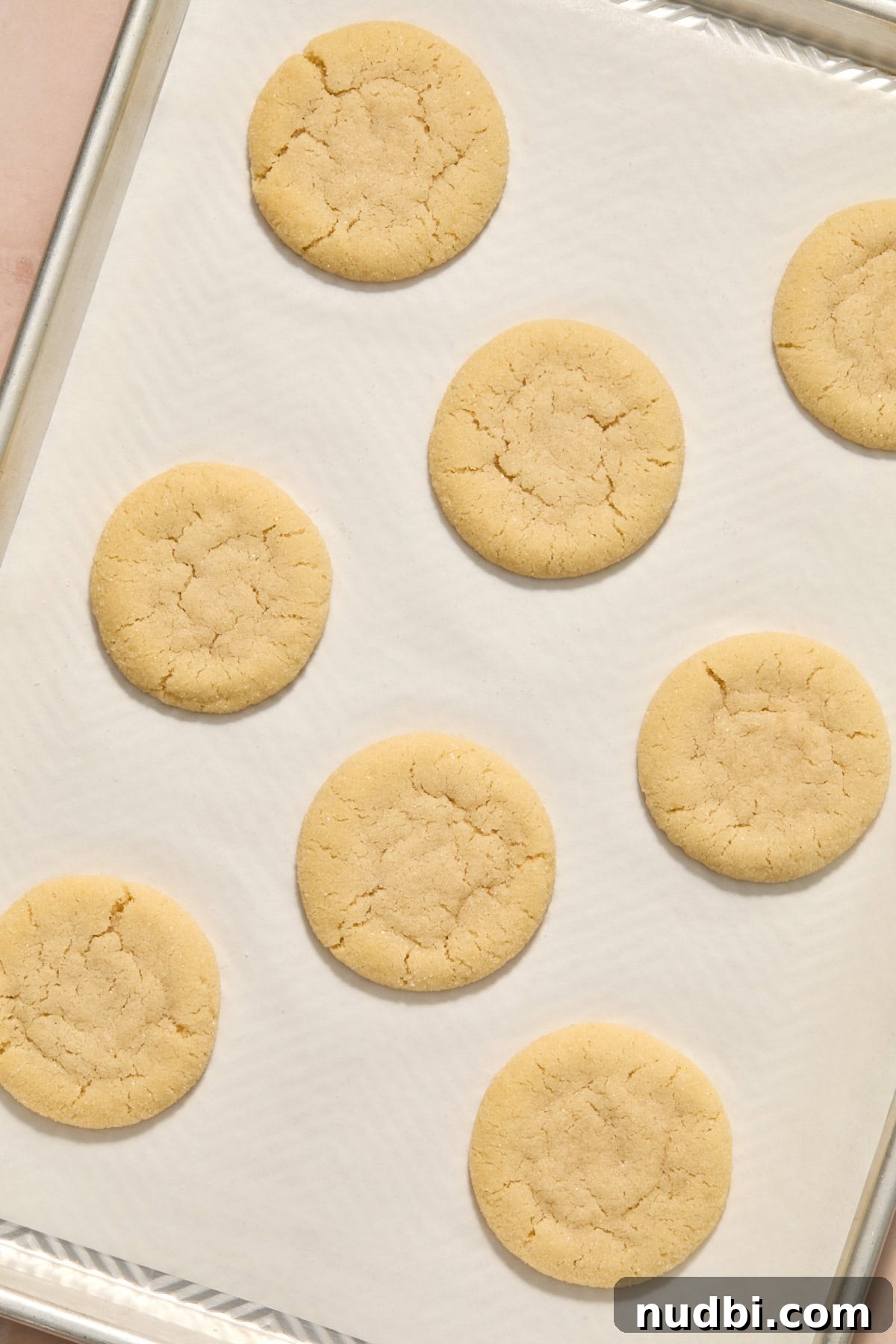Soft and Chewy Eggless Sugar Cookies Recipe 9 Baked eggless sugar cookies on pan.