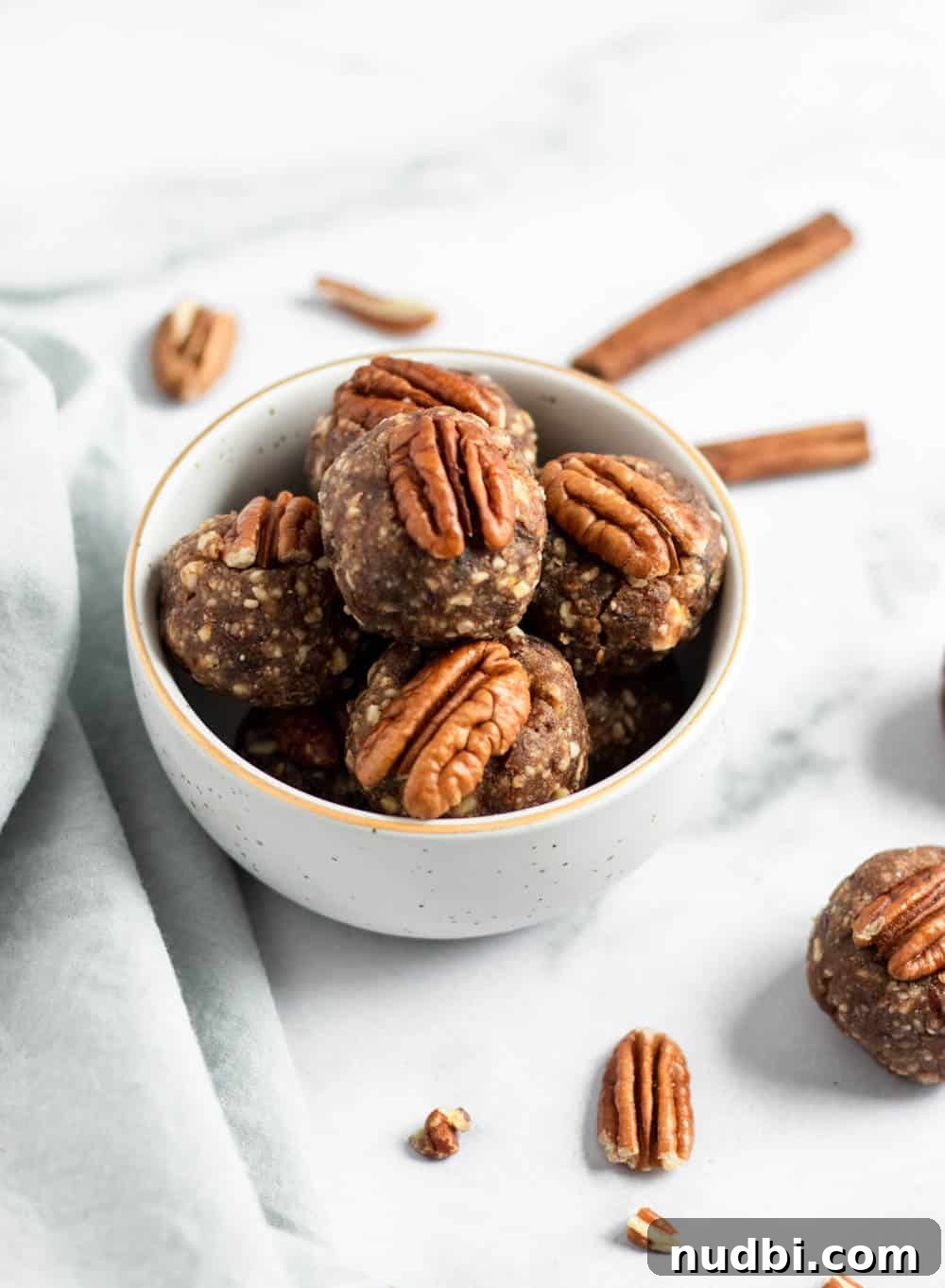 Pecan Pie Energy Bites: No-Bake Snack for Lasting Energy 3 Bowl of energy bites with pecans.