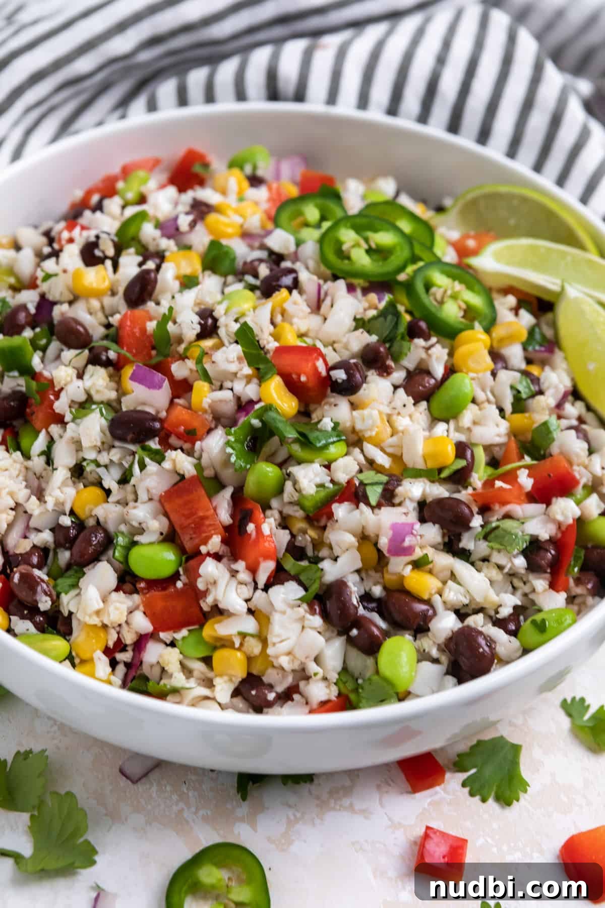 Black Bean & Cauliflower Rice Salad with Zesty Lime Dressing 6 White bowl with cauliflower black bean salad with jalapeño.