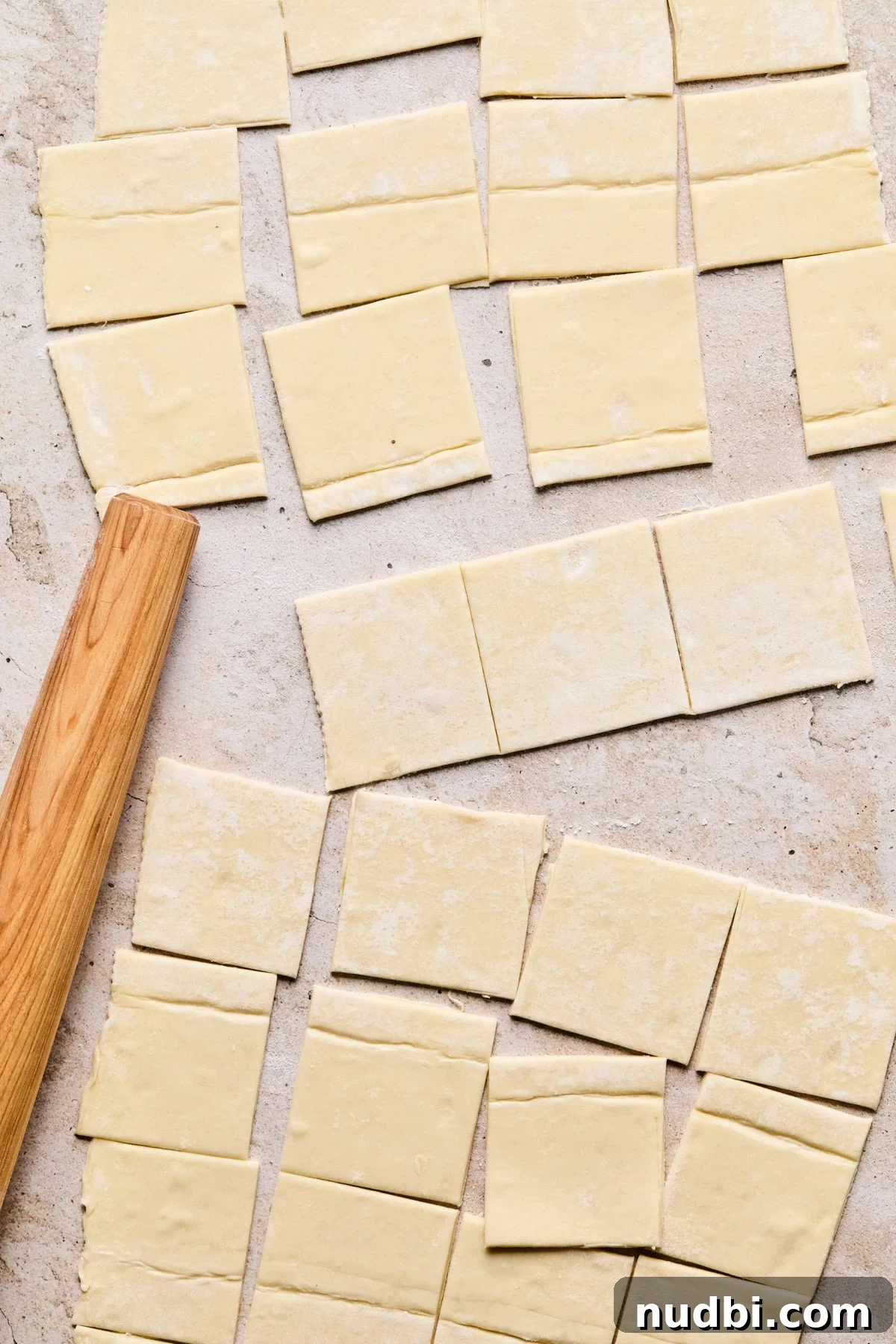 Melted Brie Puff Pastry Bites with Honey & Thyme 4 Cut puff pastry on surface with rolling pin.
