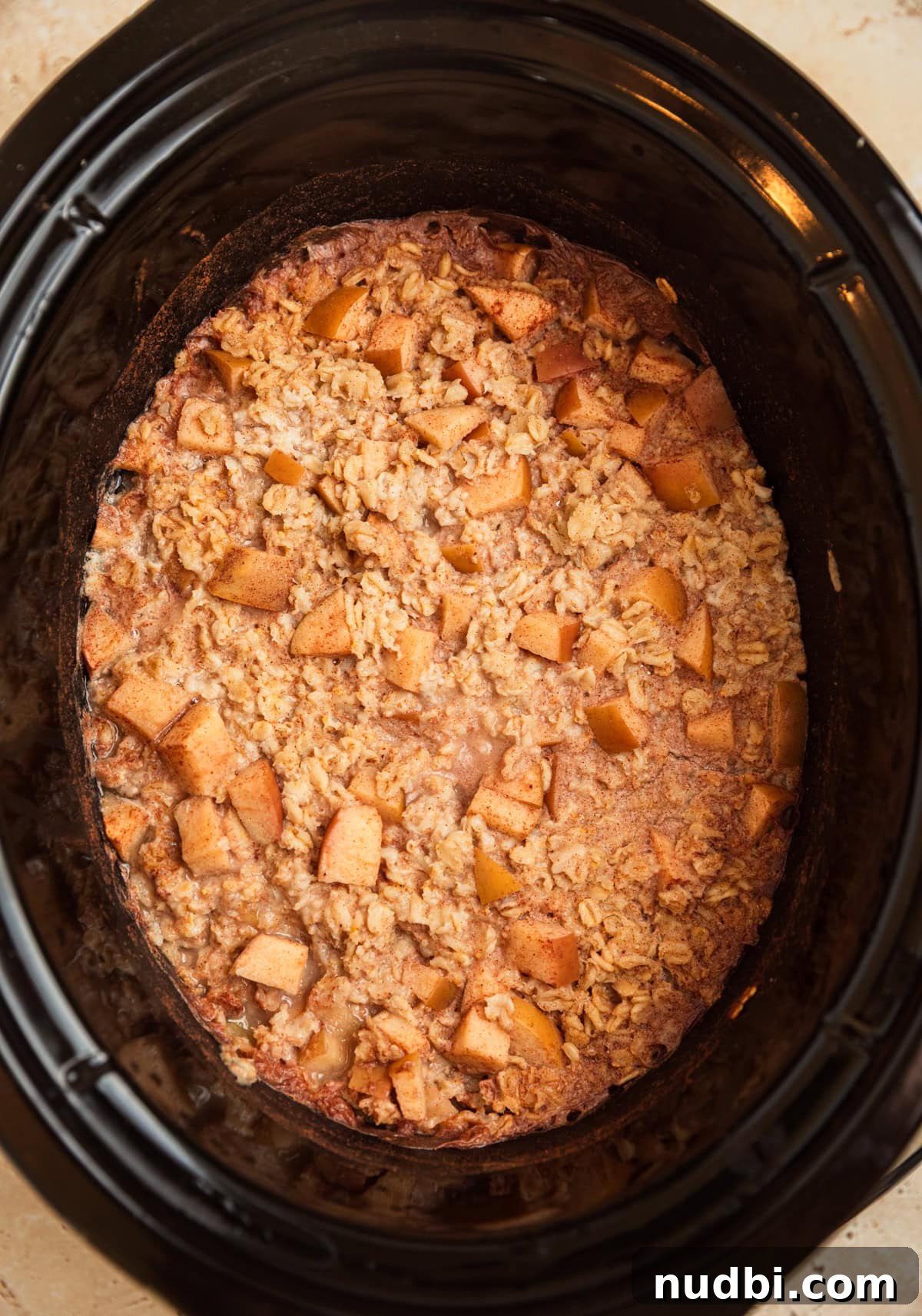 Slow Cooker Apple Cinnamon Oatmeal Recipe for Breakfast 6 Apple cinnamon oatmeal cooked in slow cooker.