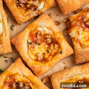 Festive Holiday Appetizers and Party Snacks Guide 5 Puff pastry squares with goat cheese and apricot jam.