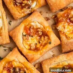 Puff pastry squares with goat cheese and apricot jam.