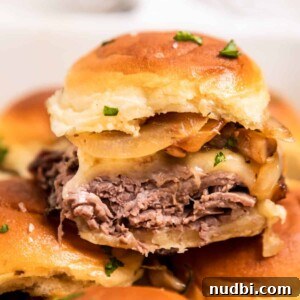 Festive Holiday Appetizers and Party Snacks Guide 9 Roast beef slider with cheese, onion and mushrooms.