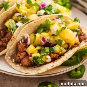 30-Minute Dinner Recipes You'll Love 7 Ground pork tacos in tortillas topped with pineapple, jalapeño and cilantro salsa.