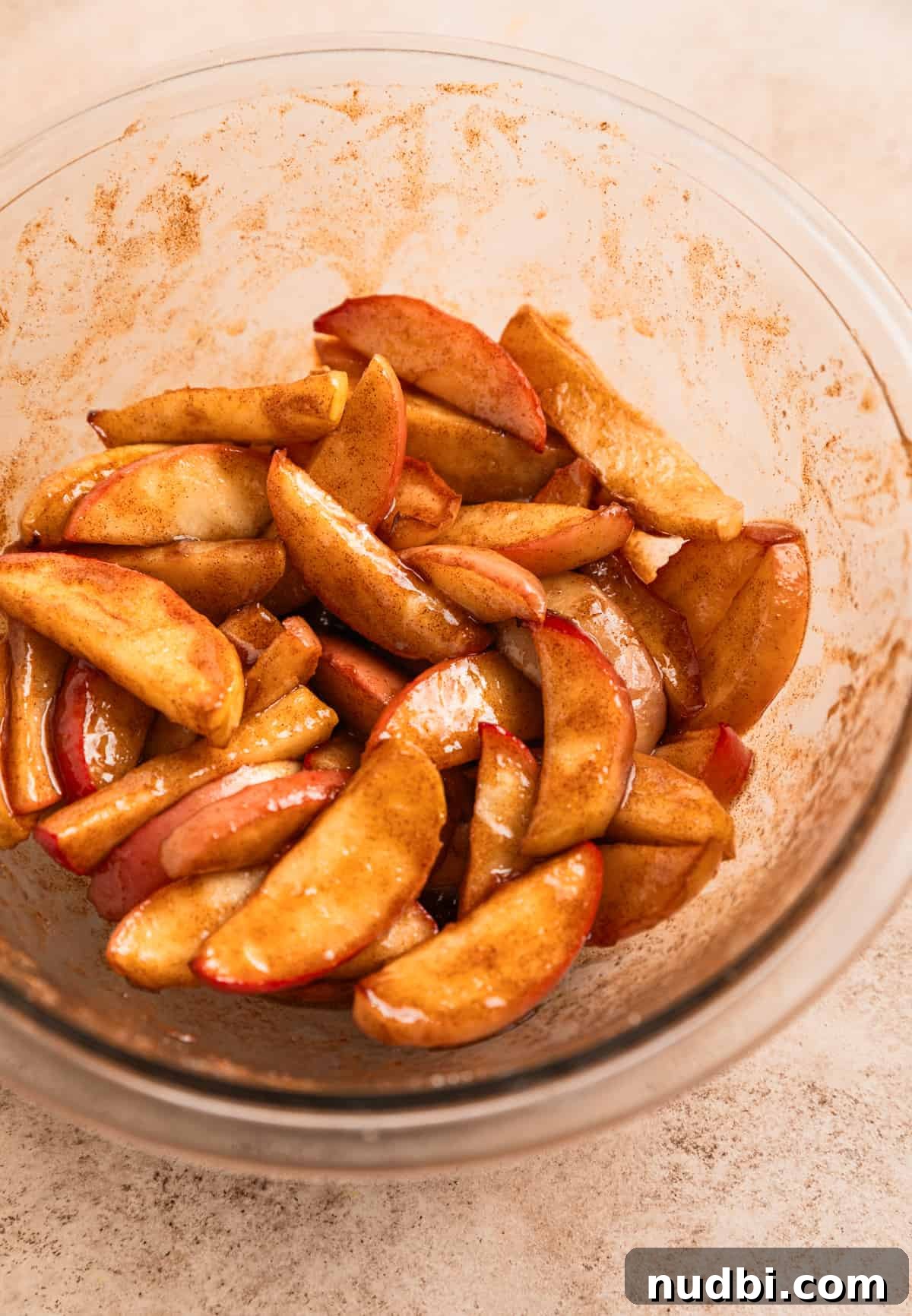 Crispy Caramelized Apples in the Air Fryer 7 Sliced apples tossed in butter, cinnamon and sugar.