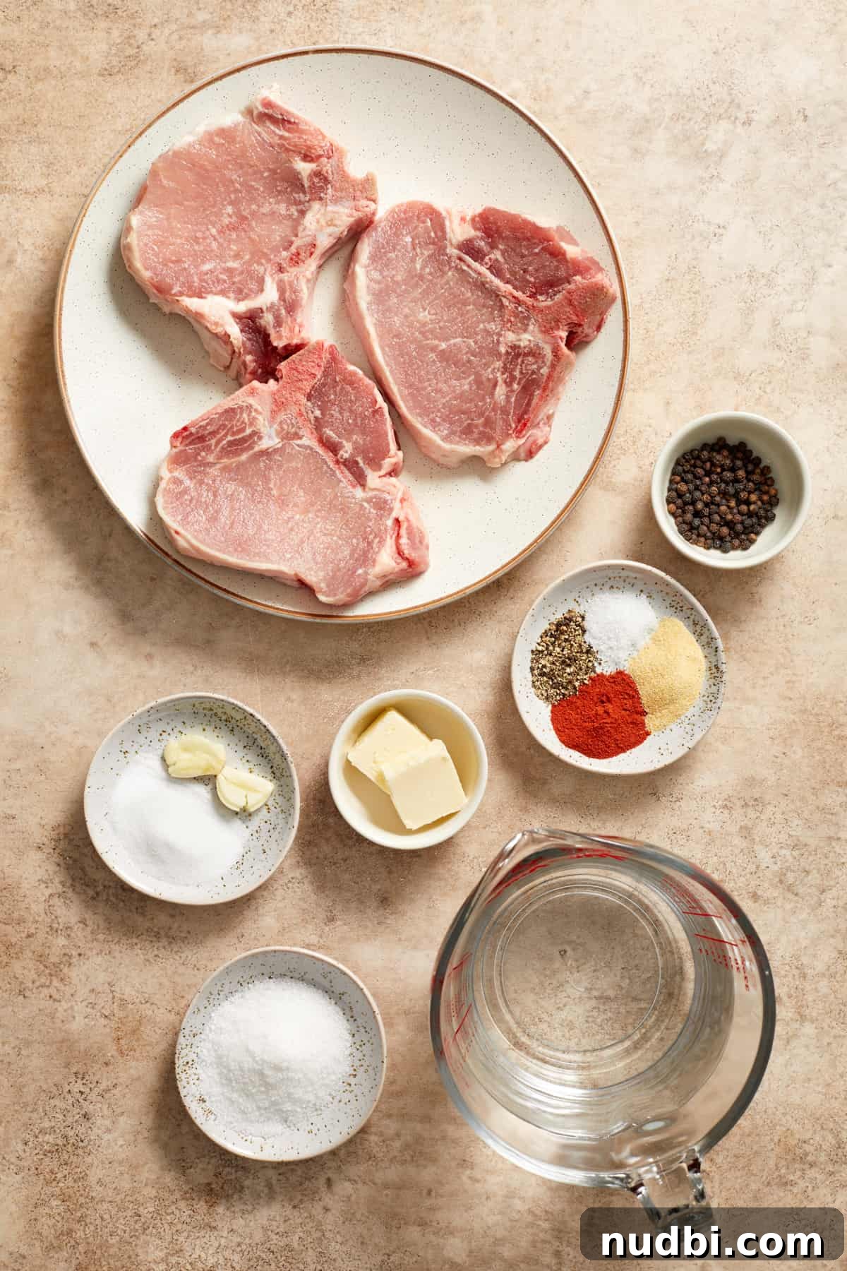 Creamy Mushroom Pork Chops with Garlic and Thyme 5 Pork chops, seasoning, water, butter and other ingredients to make cream of mushroom pork chops.