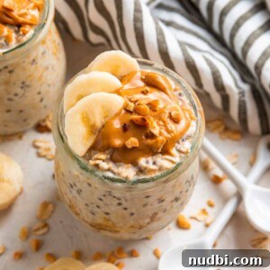 Creamy Overnight Oats Recipes for Quick Healthy Breakfasts 3 Glass jar with overnight oats topped with sliced banana and topped with peanut butter.