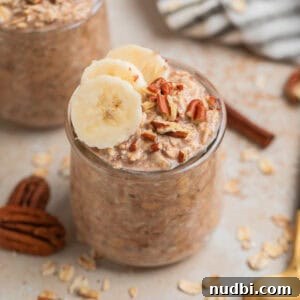 Creamy Overnight Oats Recipes for Quick Healthy Breakfasts 5 Glass jar with overnight oatmeal topped with bananas and nuts.