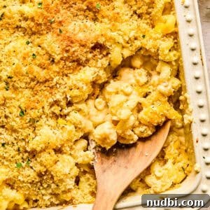 Cozy Dinner Recipes for Comforting Weeknight Meals 22 Macaroni and cheese in pan baked with breadcrumbs and chopped parsley on top.