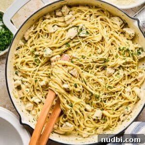 Cozy Dinner Recipes for Comforting Weeknight Meals 23 Pot with chicken Alfredo topped with parsley.