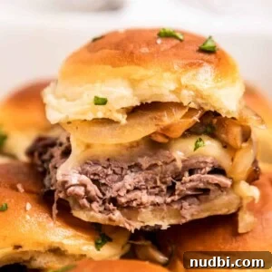 French Dip Sliders Recipe with Savory Au Jus for Dipping 14 Roast beef slider with cheese, onion and mushrooms.