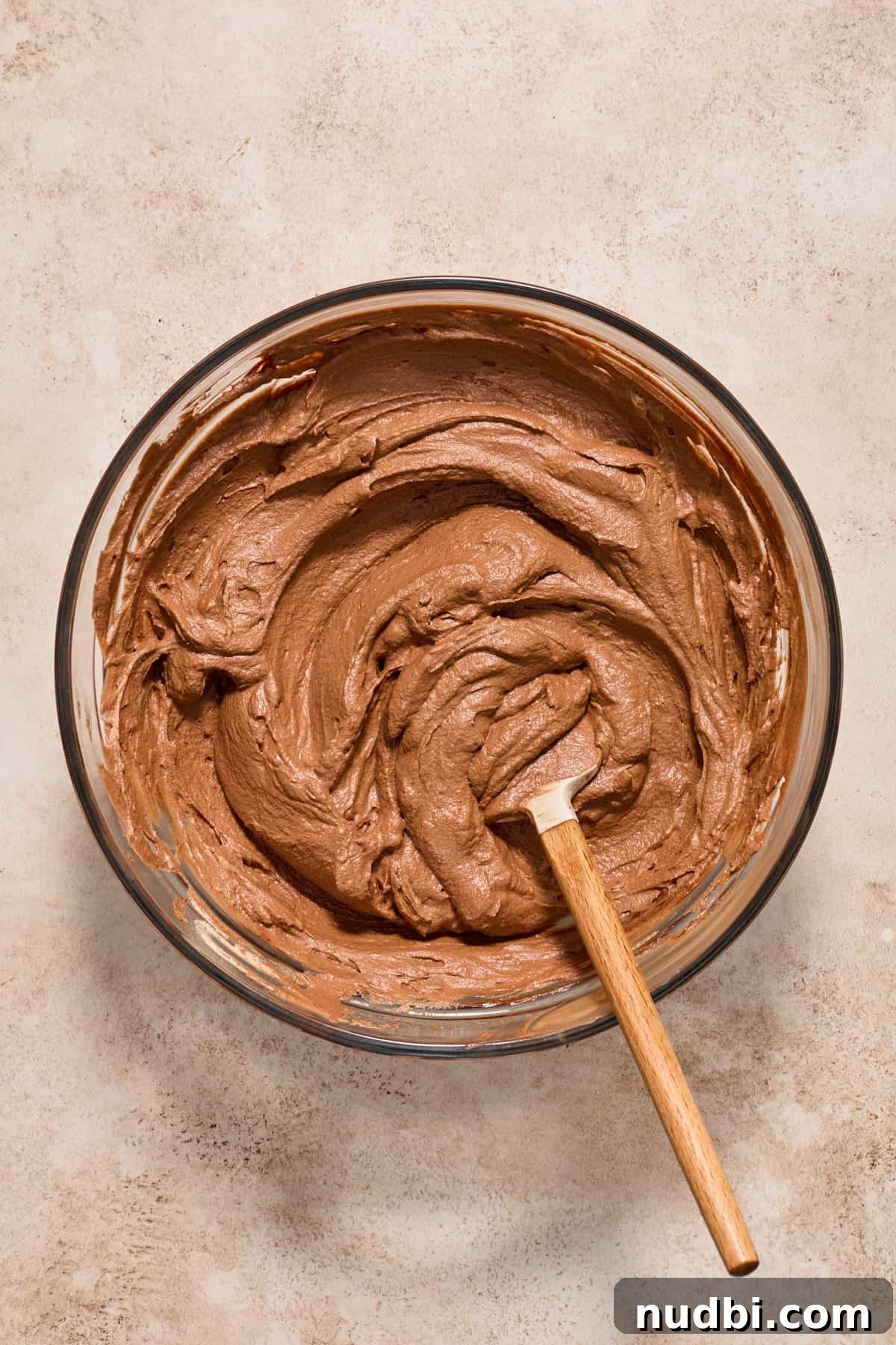 No-Bake Chocolate Cream Pie Recipe for Rich, No-Fuss Dessert 11 Chocolate whipped cream folded into chocolate ganache with spatula in mixture.