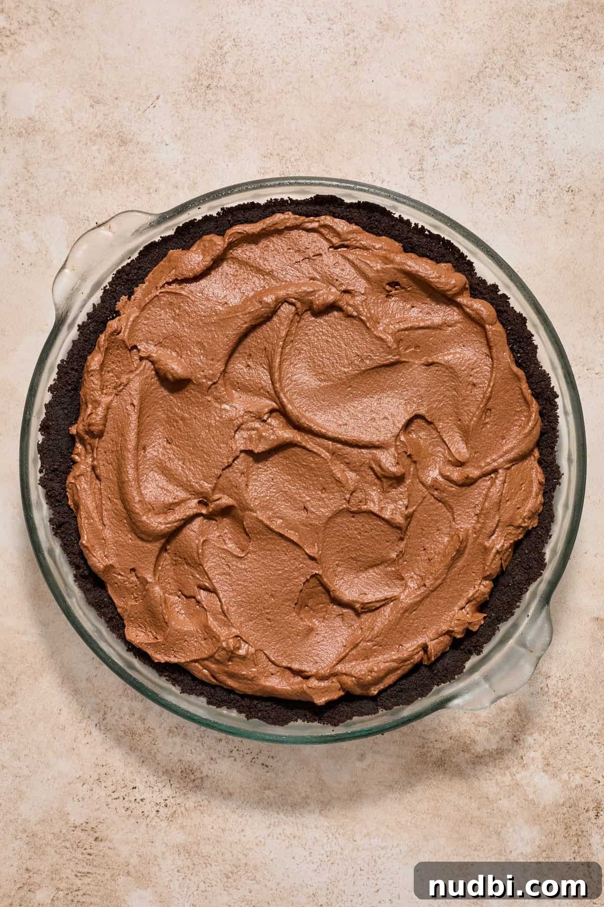 No-Bake Chocolate Cream Pie Recipe for Rich, No-Fuss Dessert 12 Chocolate pie filling spread into Oreo crust pie pan.