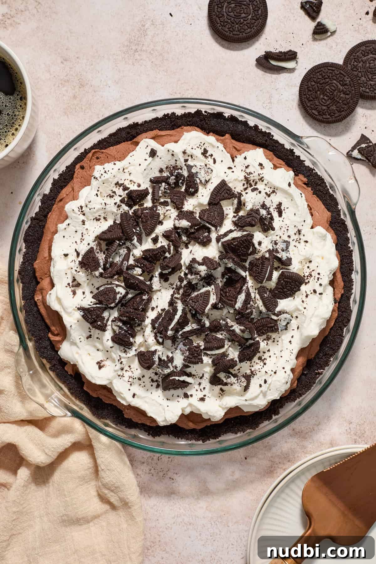 No-Bake Chocolate Cream Pie Recipe for Rich, No-Fuss Dessert 3 Overhead view of chocolate pie topped with whipped cream and chopped Oreos.