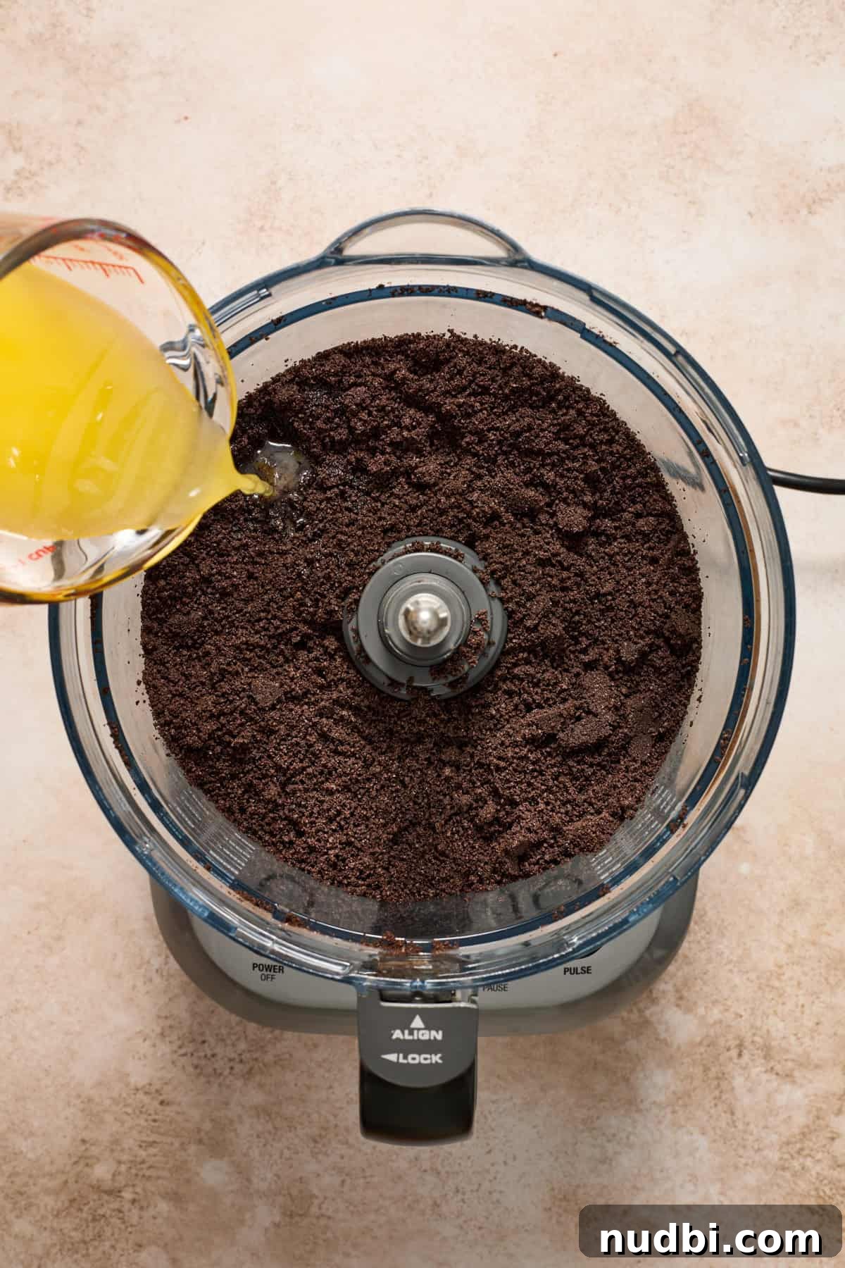 No-Bake Chocolate Cream Pie Recipe for Rich, No-Fuss Dessert 6 Food processor with crushed cookies and melted butter poured in.