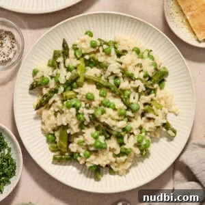 Creamy Spring Risotto with Peas and Asparagus 14 Plate with risotto with spring peas and asparagus.