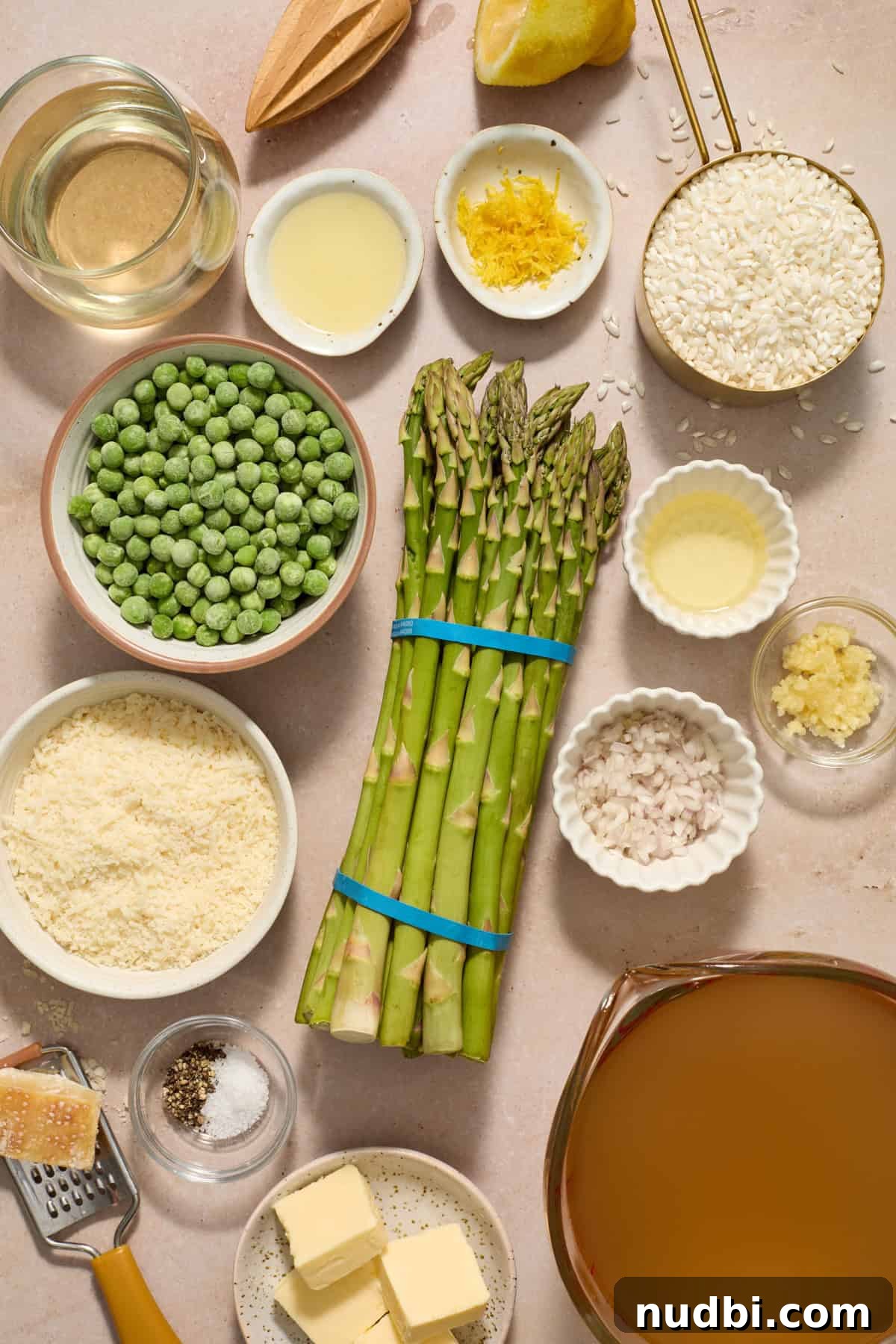 Creamy Spring Risotto with Peas and Asparagus 3 Asparagus, broth, parmesan, broth, white wine and other ingredients prepped for recipe.