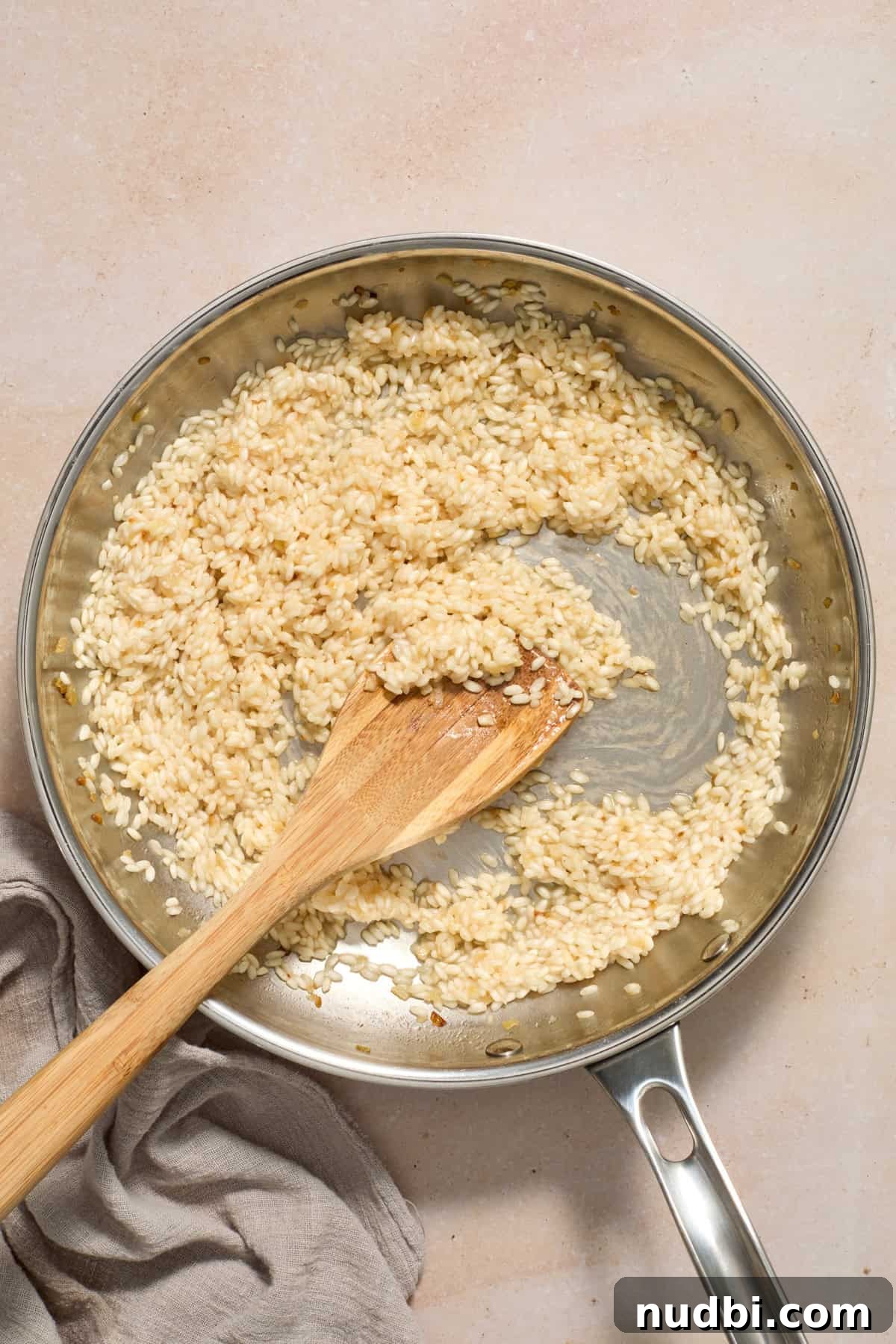 Creamy Spring Risotto with Peas and Asparagus 8 Wine added to skillet where risotto is being prepped.