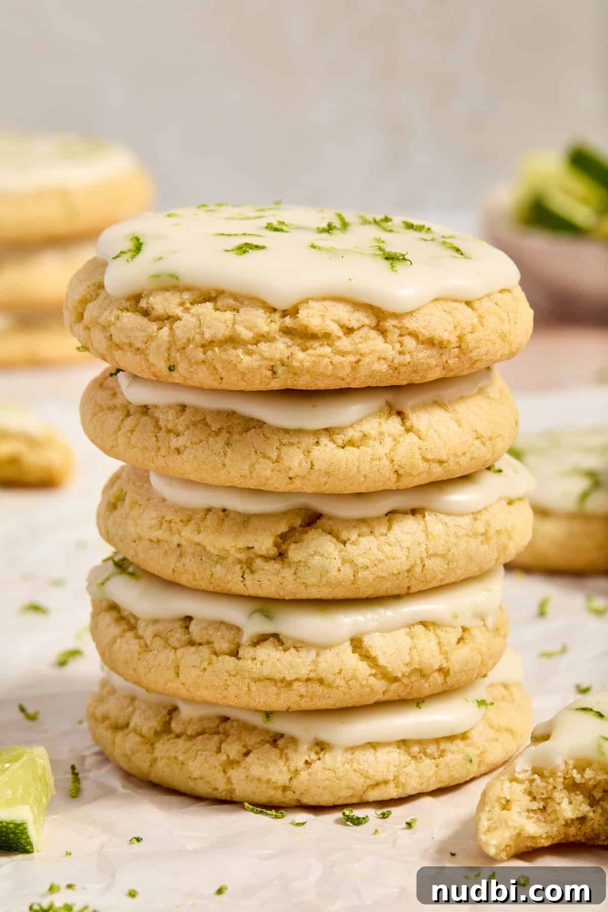Zesty Key Lime Cookie Recipe for Luscious Citrus Cookies 11 Stack of key lime cookies with lime icing on surface.