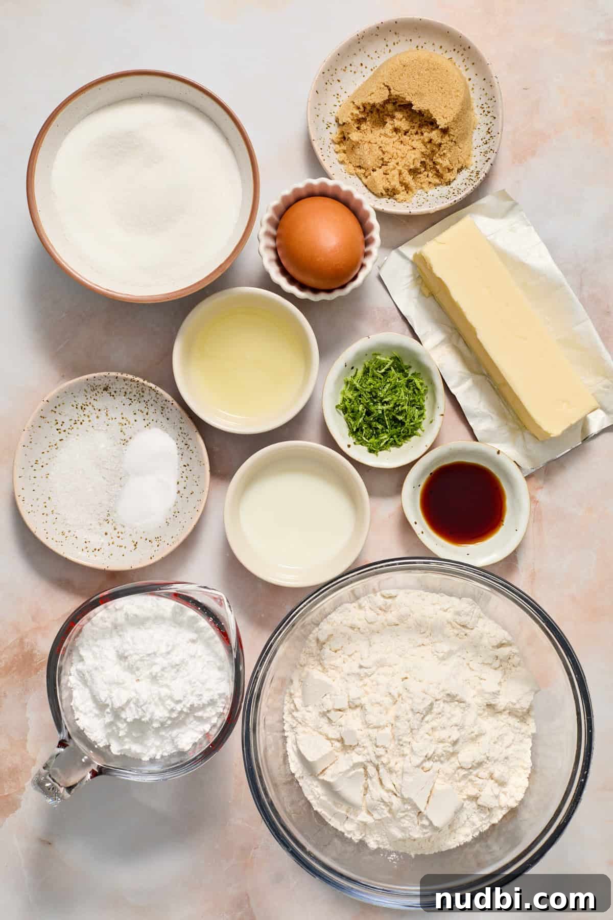 Zesty Key Lime Cookie Recipe for Luscious Citrus Cookies 3 Butter, flour, sugar, vanilla, lime zest and other ingredients arranged on surface.