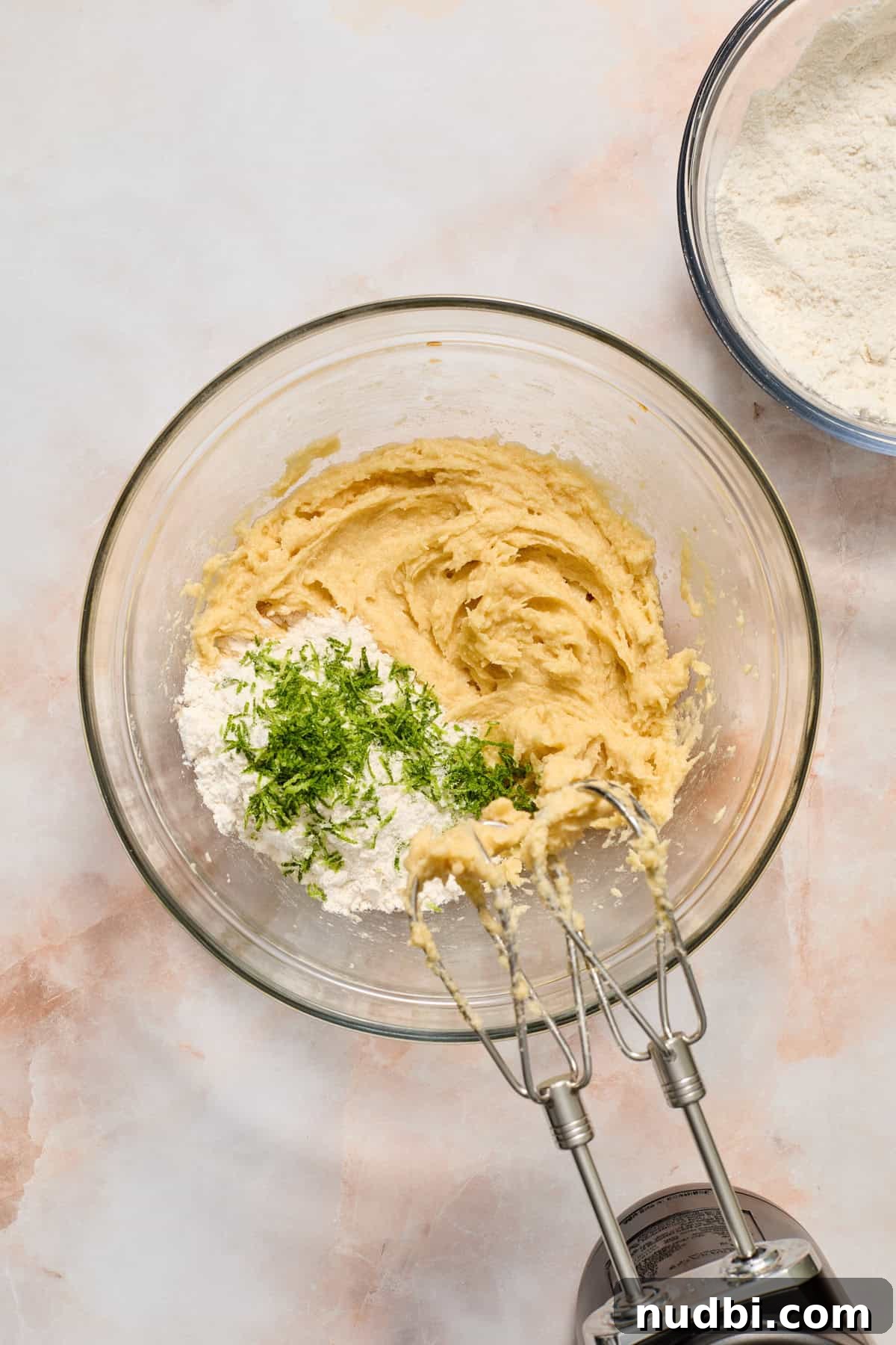 Zesty Key Lime Cookie Recipe for Luscious Citrus Cookies 6 Flour and key lime zest added to mixing bowl with wet ingredients.