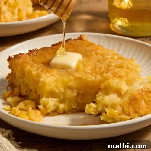 Side Dishes to Serve with Carnitas: 15 Flavor-Packed Pairings 7 Sweet jiffy cornbread casserole on plate with honey drizzling over top.