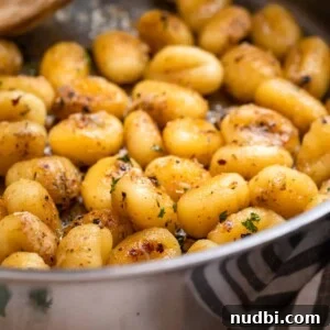10 Delicious Side Dishes to Serve With Gnocchi 3 Pan fried gnocchi tossed in butter and parmesan and topped with chopped parsley.