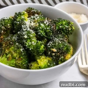 10 Delicious Side Dishes to Serve With Gnocchi 22 Air Fryer Broccoli in bowl with parmesan on top.