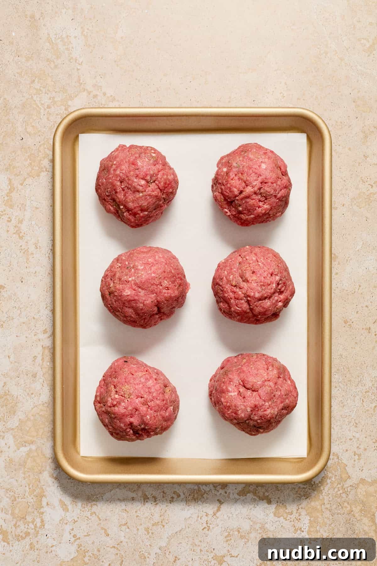 Juicy Mozzarella-Stuffed Burgers with Garlic Herb Buns 7 Mozzarella Burgers rolled into balls before cooking on sheet pan.