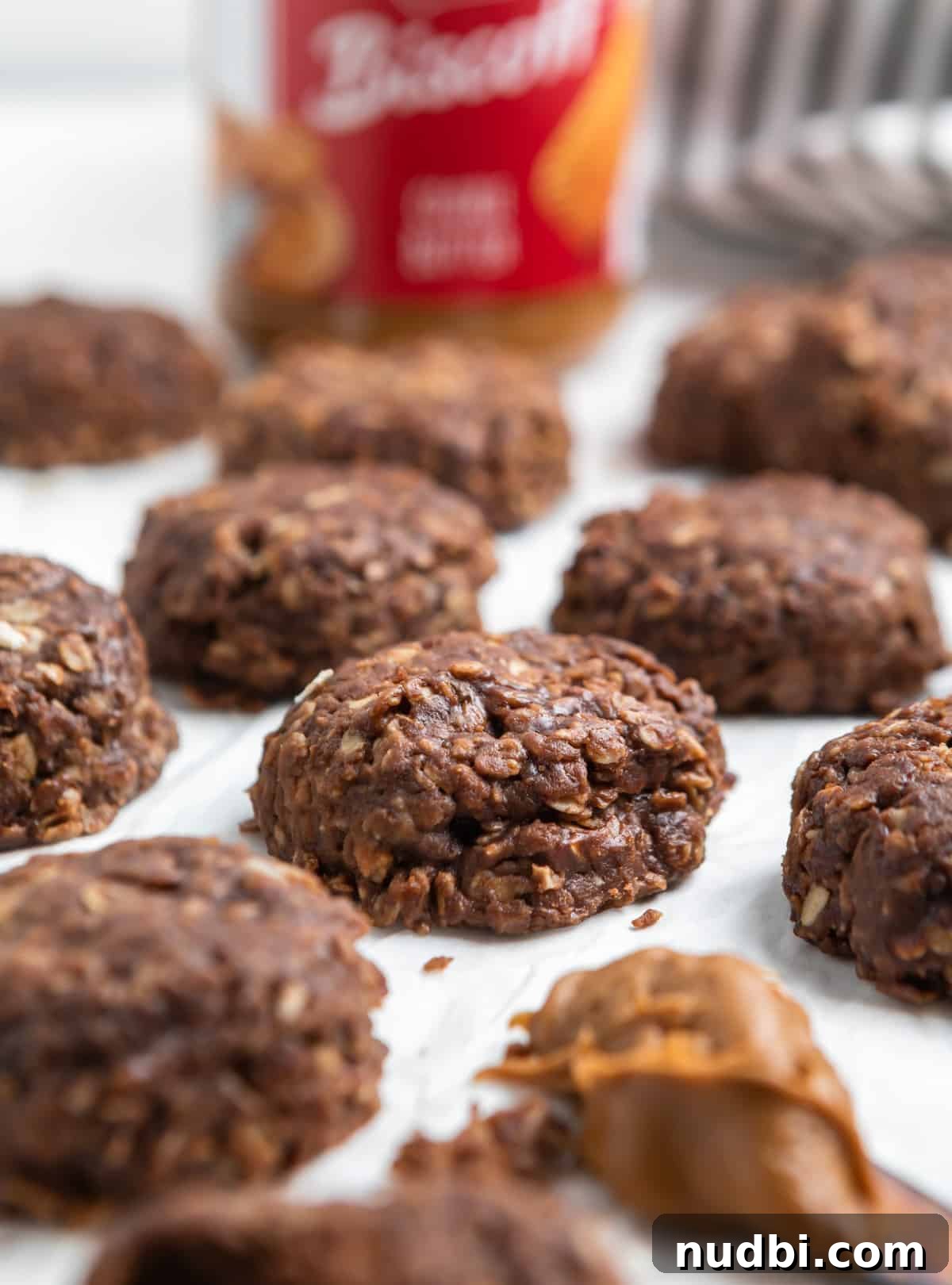No-Bake Cookie Butter Sandwich Cookies 2 No bake cookie butter cookies on parchment.