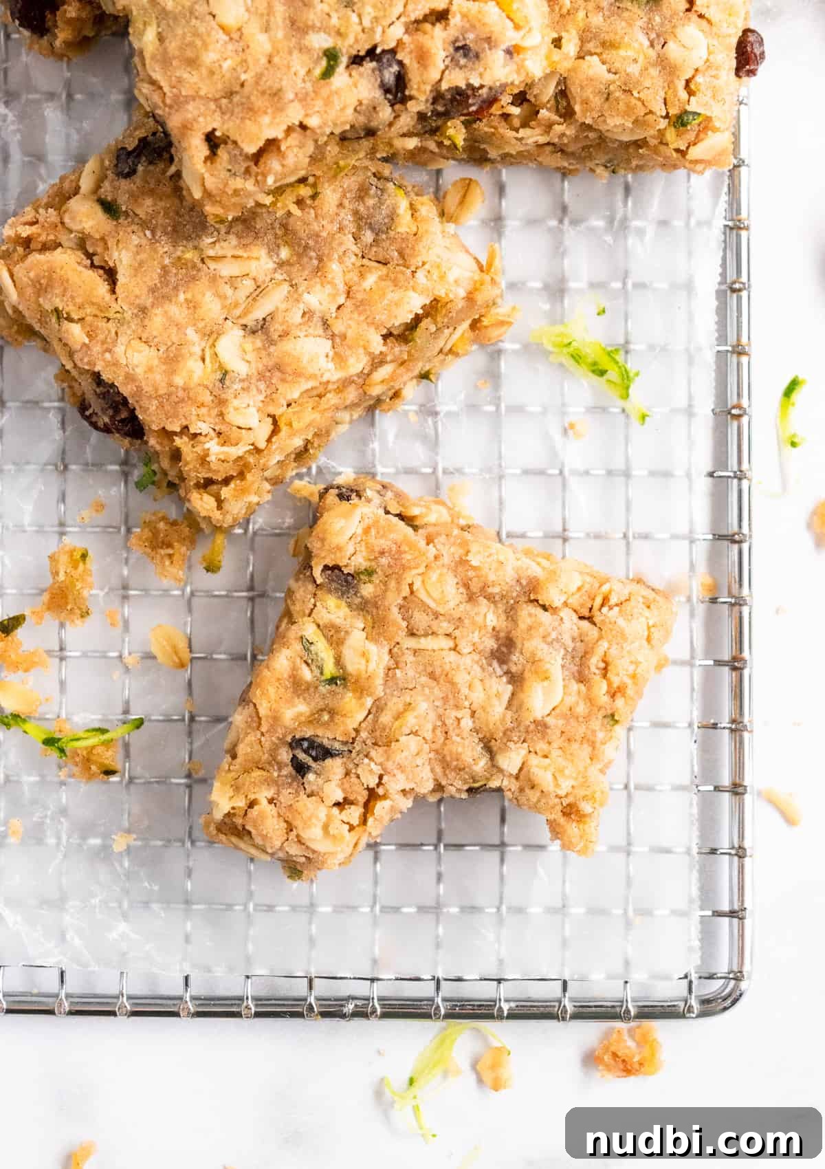 Zucchini Oat Bars Recipe: Moist Baked Snack Bars with Oats 2 Zucchini bars on cooling rack.